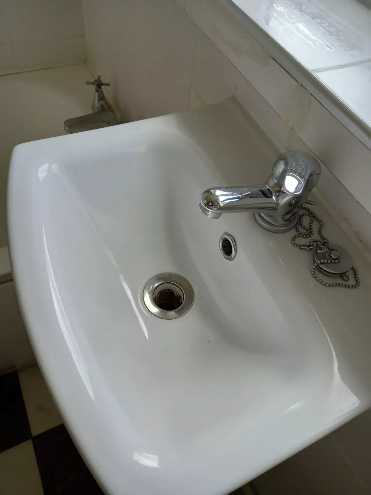 Bathroom sink and chrome fixtures polished