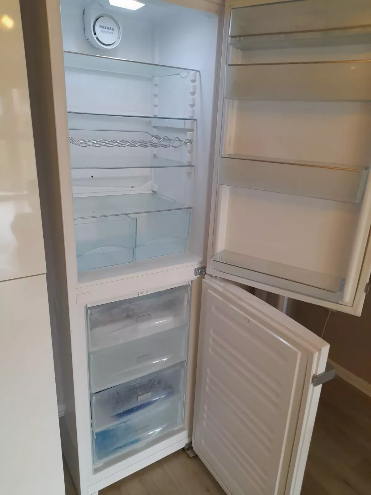 Refrigerator interior cleaned shelf by shelf